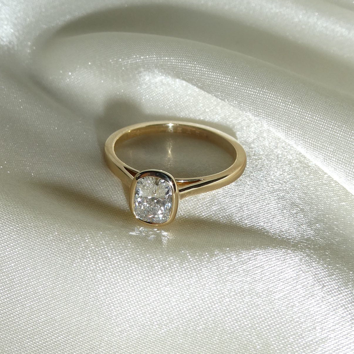 ELONGATED CUSHION BEZEL SOLITAIRE