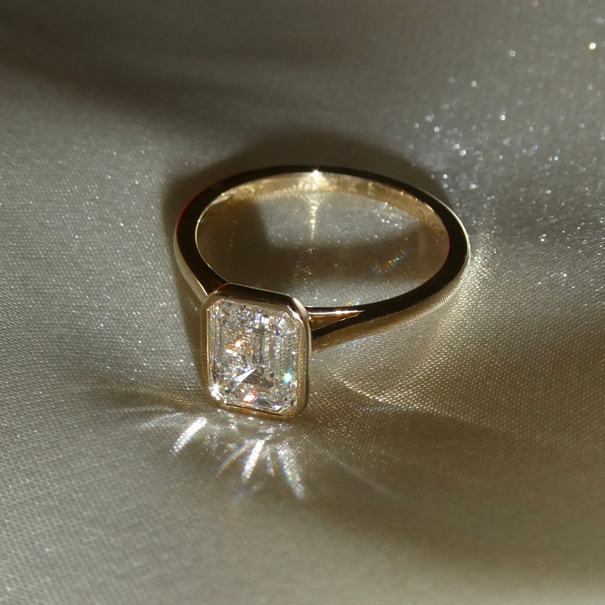 EMERALD BEZEL SOLITAIRE