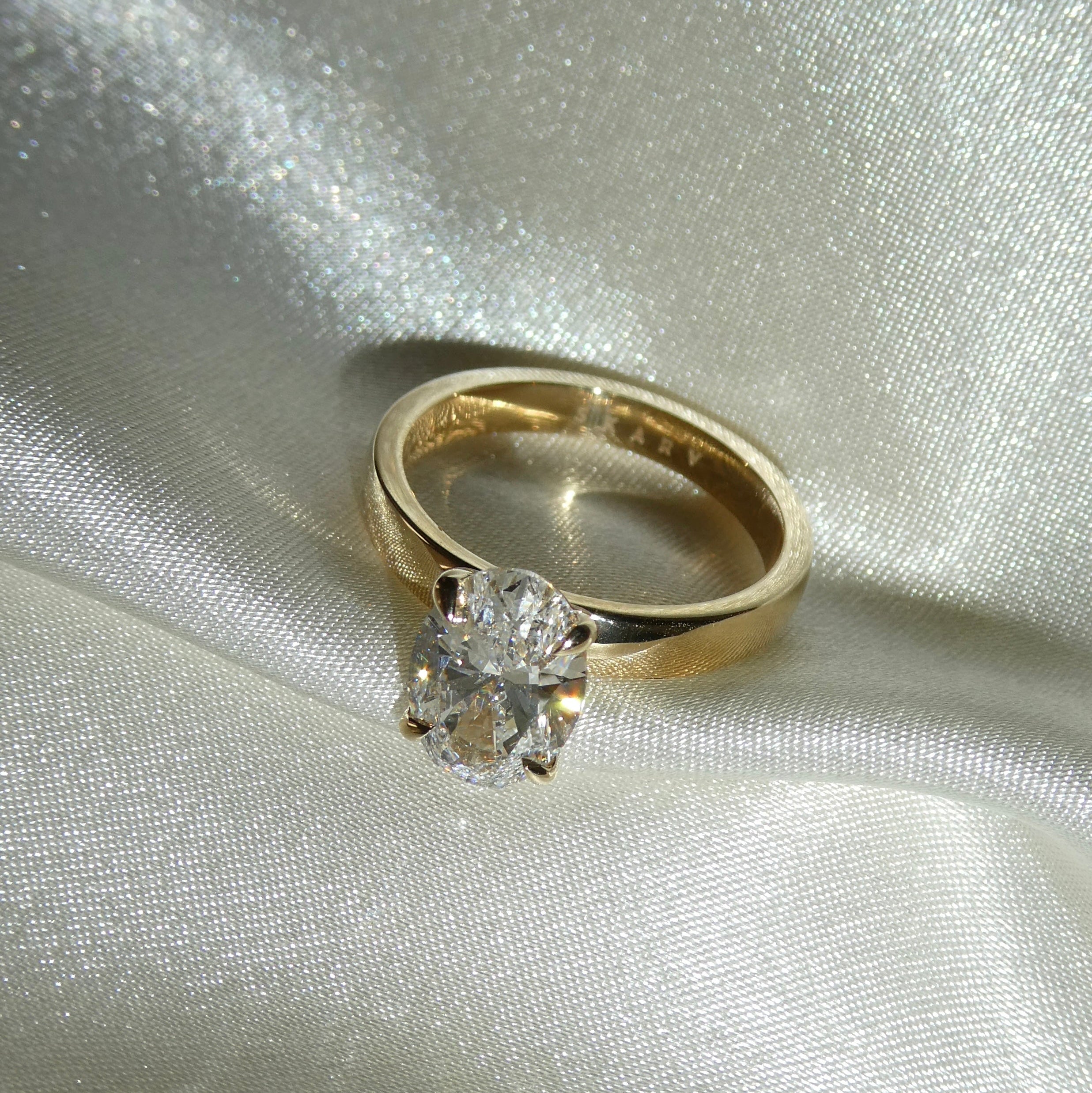 OVAL CIGAR BAND SOLITAIRE