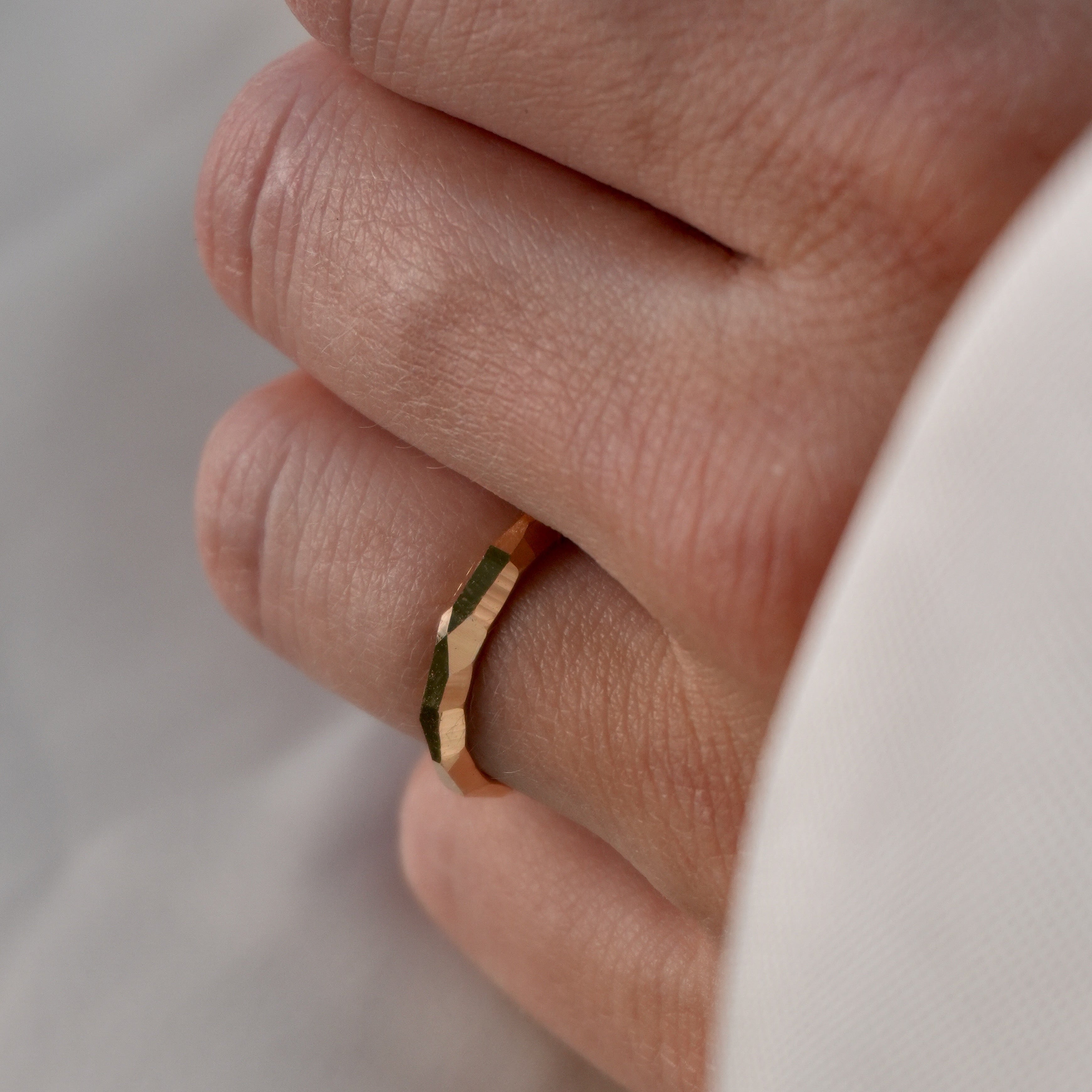 HER FACETED WEDDING BAND