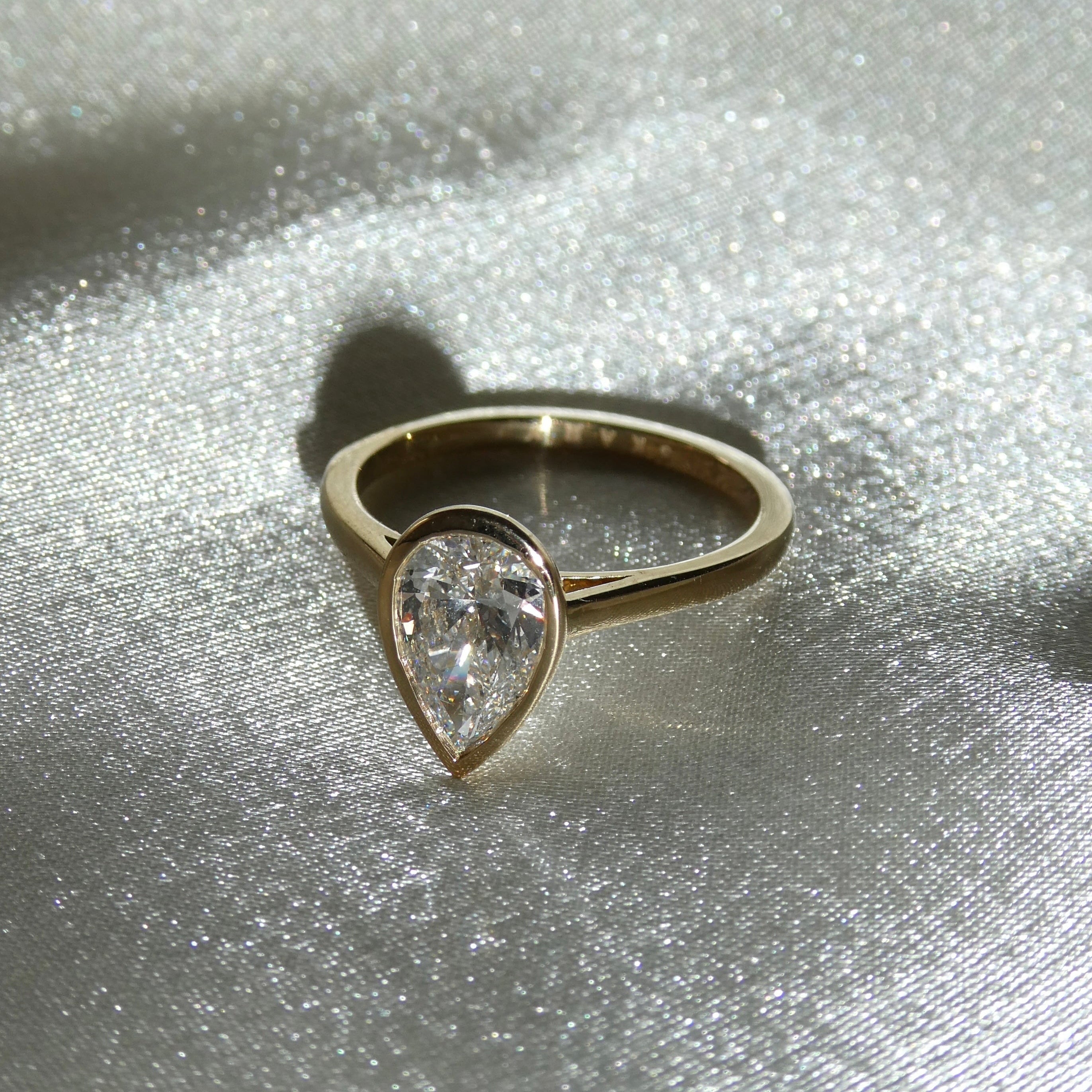 PEAR BEZEL SOLITAIRE