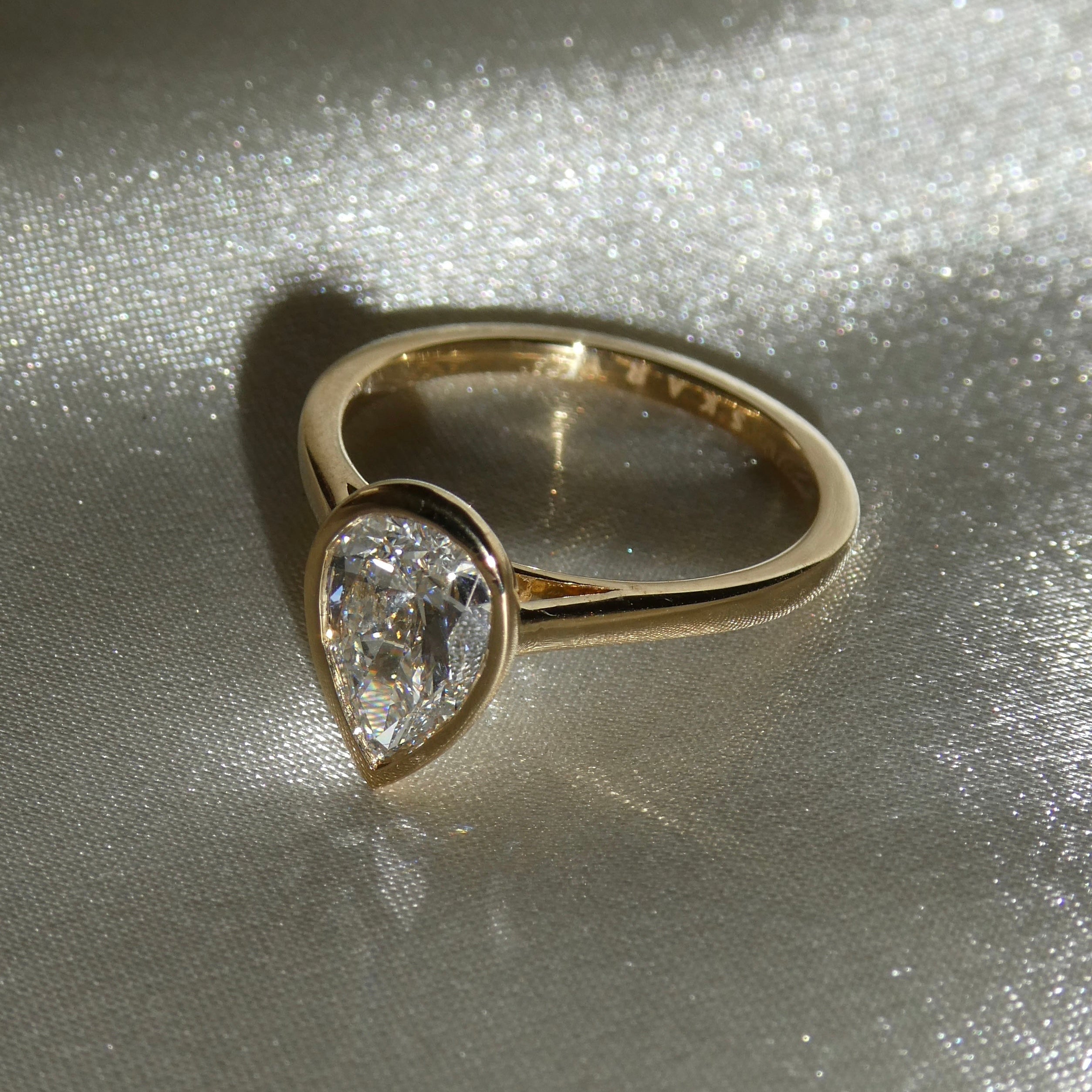 PEAR BEZEL SOLITAIRE