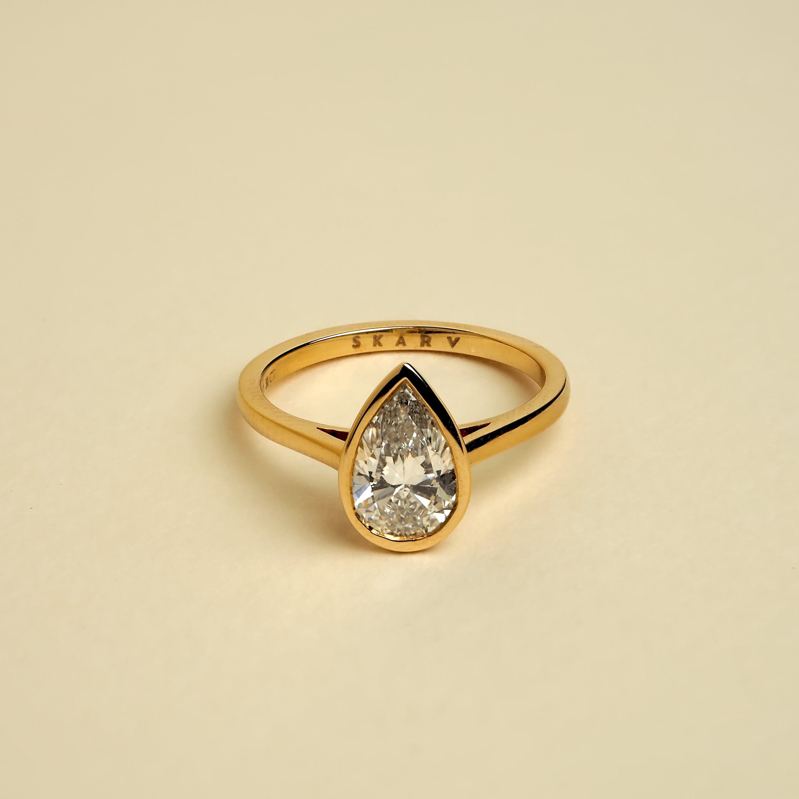 PEAR BEZEL SOLITAIRE